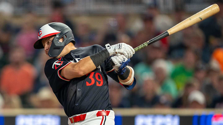 Jul 22, 2024; Minneapolis, Minnesota, USA; Minnesota Twins third baseman Diego A. Castillo (39) hits a ground rule double against the Philadelphia Phillies in the fifth inning at Target Field. Mandatory Credit: Jesse Johnson-Imagn Images