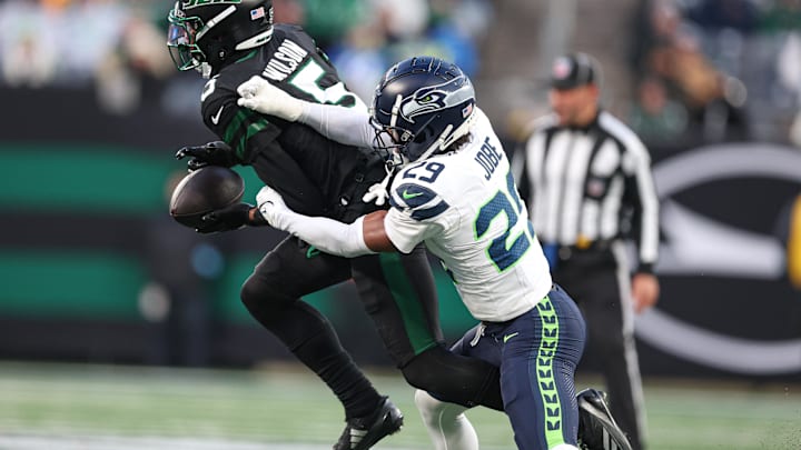 Dec 1, 2024; East Rutherford, New Jersey, USA; New York Jets wide receiver Garrett Wilson (5) makes a catch as Seattle Seahawks cornerback Josh Jobe (29) defends during the second half at MetLife Stadium. Mandatory Credit: Vincent Carchietta-Imagn Images Dec 1, 2024; East Rutherford, New Jersey, USA; New York Jets wide receiver Garrett Wilson (5) makes a catch as Seattle Seahawks cornerback Josh Jobe (29) defends during the second half at MetLife Stadium. Mandatory Credit: Vincent Carchietta-Imagn Images