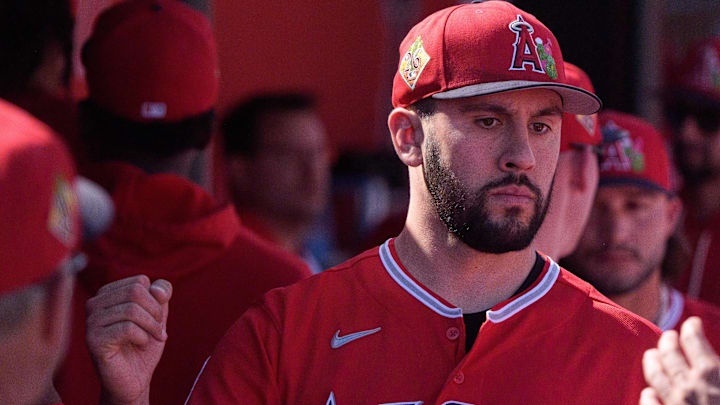 Feb 24, 2026; Tempe, Arizona, USA; Los Angeles Angels pitcher Grayson Rodriguez (21) reacts in the dugout with his team after being relieved in the second inning against the San Francisco Giants during a spring training game at Tempe Diablo Stadium. Mandatory Credit: Allan Henry-Imagn Images
