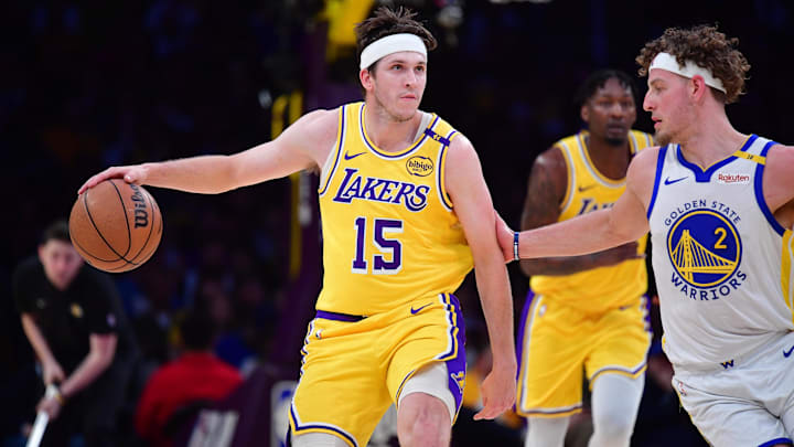 Apr 3, 2025; Los Angeles, California, USA: Los Angeles Lakers guard Austin Reaves (15) moves the ball against Golden State Warriors guard Brandin Podziemski (2) during the first half at Crypto.com Arena. Mandatory Credit: Gary A. Vasquez-Imagn Images Apr 3, 2025; Los Angeles, California, USA: Los Angeles Lakers guard Austin Reaves (15) moves the ball against Golden State Warriors guard Brandin Podziemski (2) during the first half at Crypto.com Arena. Mandatory Credit: Gary A. Vasquez-Imagn Images