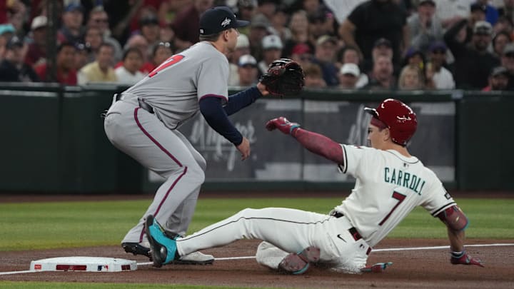 Apr 27, 2025; Phoenix, Arizona, USA; Arizona Diamondbacks outfielder Corbin Carroll (7) slides into thirdbase after hitting a triple in front of Atlanta Braves third base Austin Riley (27) in the first inning at Chase Field. Mandatory Credit: Rick Scuteri-Imagn Images Apr 27, 2025; Phoenix, Arizona, USA; Arizona Diamondbacks outfielder Corbin Carroll (7) slides into thirdbase after hitting a triple in front of Atlanta Braves third base Austin Riley (27) in the first inning at Chase Field. Mandatory Credit: Rick Scuteri-Imagn Images