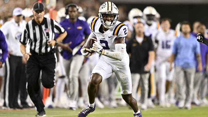 Oct 26, 2024; College Station, Texas, USA; LSU Tigers wide receiver Kyren Lacy (2) runs the ball during the second quarter against the Texas A&M Aggies. The Aggies defeated the Tigers 38-23; at Kyle Field. Mandatory Credit: Maria Lysaker-Imagn Images.  