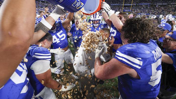 Dec 27, 2025; Orlando, FL, USA;  Pop-Tarts are dumped on head coach Kalani Sitake after beating Georgia Tech Yellow Jackets in the Pop-Tarts Bowl at Camping World Stadium. Mandatory Credit: Nathan Ray Seebeck-Imagn Images
