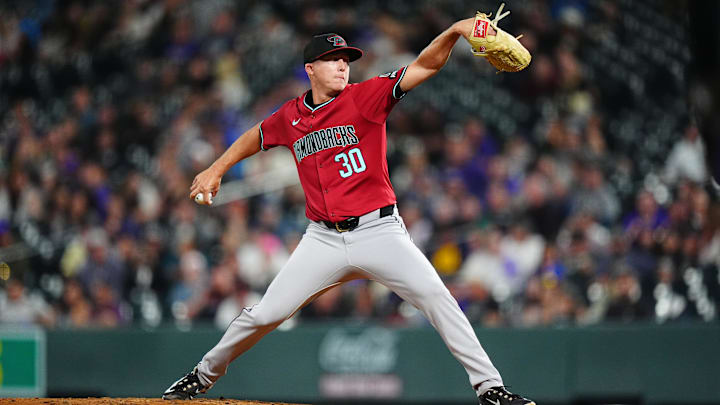 Sep 17, 2024; Denver, Colorado, USA; Arizona Diamondbacks relief pitcher Scott McGough (30) delivers a pitch in the fifth inning against the Colorado Rockies at Coors Field. Mandatory Credit: Ron Chenoy-Imagn Images