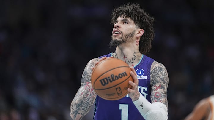 Feb 11, 2026; Charlotte, North Carolina, USA; Charlotte Hornets guard LaMelo Ball (1) shoots a free throw during the second half against the Atlanta Hawks at Spectrum Center. Mandatory Credit: Jim Dedmon-Imagn Images