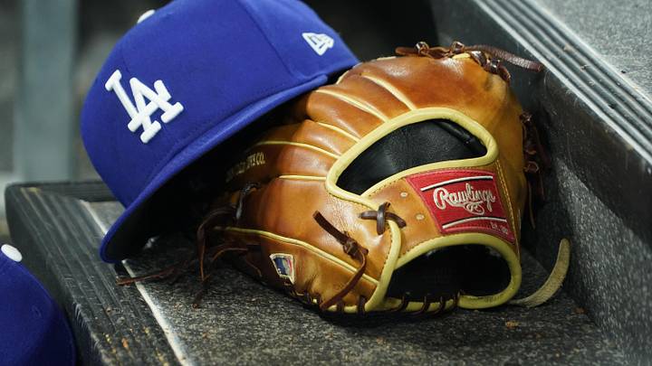Apr 28, 2024; Toronto, Ontario, CAN; A hat and glove of an Los Angeles Dodgers player durng a game against the Toronto Blue Jays at Rogers Centre. Mandatory Credit: John E. Sokolowski-Imagn Images Apr 28, 2024; Toronto, Ontario, CAN; A hat and glove of an Los Angeles Dodgers player durng a game against the Toronto Blue Jays at Rogers Centre. Mandatory Credit: John E. Sokolowski-Imagn Images