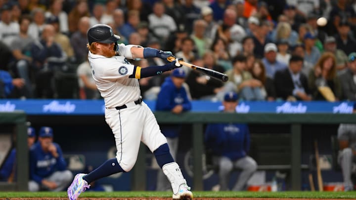 Seattle Mariners designated hitter Justin Turner (2) hits a home run against the Texas Rangers during the fourth inning at T-Mobile Park on Aug 12.