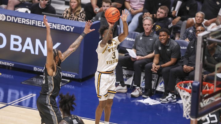 Mar 6, 2026; Morgantown, West Virginia, USA; West Virginia Mountaineers guard Honor Huff (3) shoots a three-point shot during the first half against the UCF Knights at Hope Coliseum. Mandatory Credit: Ben Queen-Imagn Images