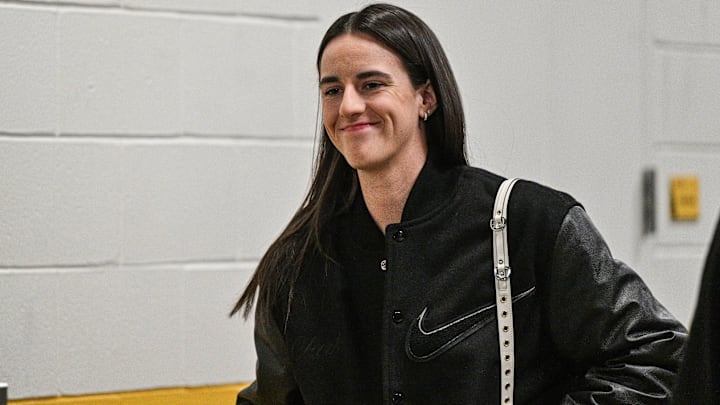 Former Iowa Hawkeyes player Caitlin Clark enters Carver-Hawkeye Arena before the game against the USC Trojans.