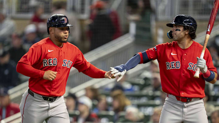 Apr 13, 2026; Minneapolis, Minnesota, USA; Boston Red Sox first baseman Willson Contreras (40) shakes hands with second baseman Marcelo Mayer (11) after scoring a run against the Minnesota Twins in the sixth inning at Target Field. Mandatory Credit: Jesse Johnson-Imagn Images