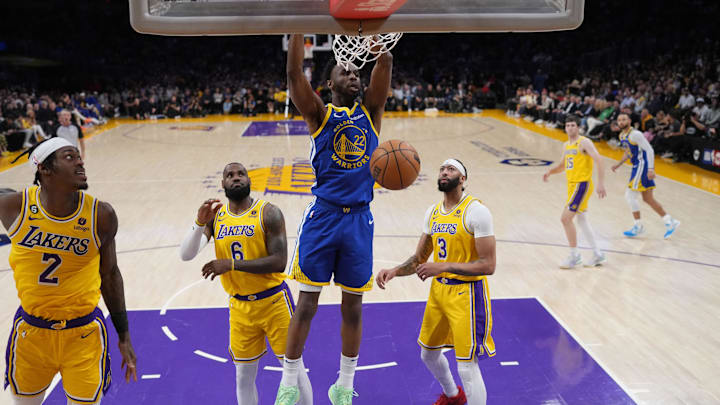 May 8, 2023; Los Angeles, California, USA; Andrew Wiggins dunks the ball against Los Angeles Lakers forward Jarred Vanderbilt (2), forward LeBron James (6) and forward Anthony Davis (3) in the first half of game four of the 2023 NBA playoffs at Crypto.com Arena. Mandatory Credit: Kirby Lee-Imagn Images