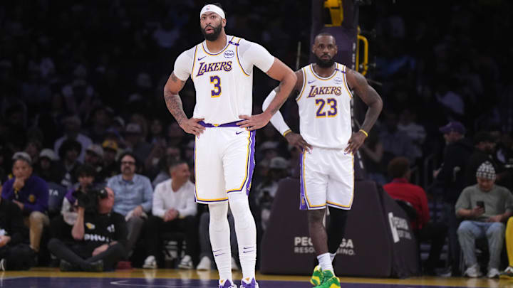Dec 15, 2024; Los Angeles, California, USA; Los Angeles Lakers forward Anthony Davis (3) and forward LeBron James (23) react in the first half against the Memphis Grizzlies at Crypto.com Arena. Mandatory Credit: Kirby Lee-Imagn Images