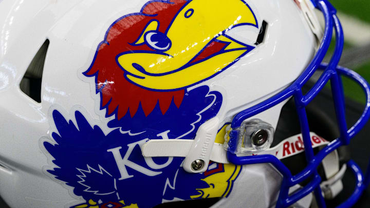 Jul 14, 2022; Arlington, TX, USA; A view of the Kansas Jayhawks helmet logo during the Big 12 Media Day at AT&T Stadium. Mandatory Credit: Jerome Miron-Imagn Images