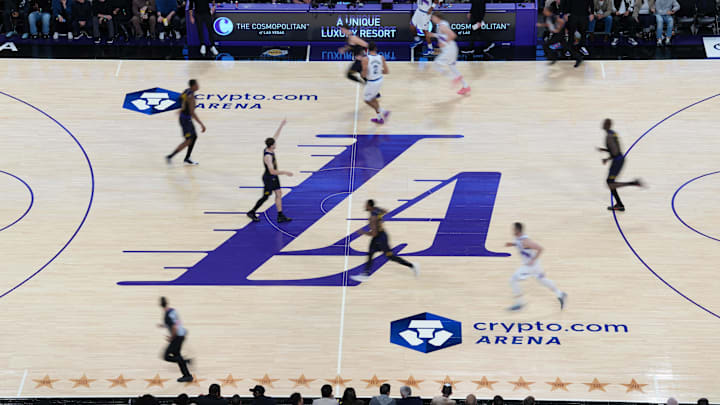 Nov 18, 2025; Los Angeles, California, USA; A general overall view of the Los Angeles Lakers city connect logo at midcourt against the Utah Jazz at Crypto.com Arena. Mandatory Credit: Kirby Lee-Imagn Images