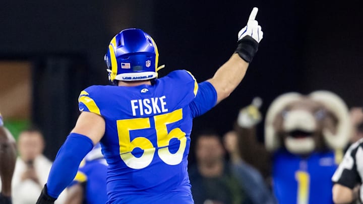 Jan 13, 2025; Glendale, AZ, USA; Los Angeles Rams defensive tackle Braden Fiske (55) celebrates a touchdown  against the Minnesota Vikings during an NFC wild card game at State Farm Stadium. Mandatory Credit: Mark J. Rebilas-Imagn Images