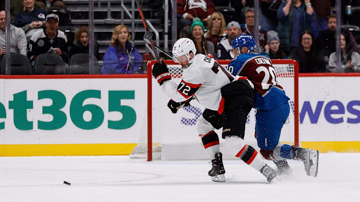Oct 27, 2024; Denver, Colorado, USA; Ottawa Senators defenseman Thomas Chabot (72) chases down a loose puck against Colorado Avalanche center Ross Colton (20) on an open net in the third period at Ball Arena. Mandatory Credit: Isaiah J. Downing-Imagn Images