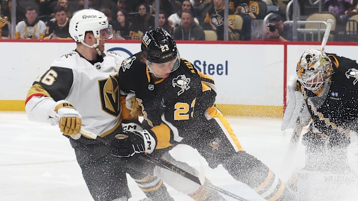 Mar 11, 2025; Pittsburgh, Pennsylvania, USA;  Pittsburgh Penguins goaltender Tristan Jarry (35) makes a save against the Vegas Golden Knights left wing Pavel Dorofeyev (16) as Penguins defenseman Vladislav Kolyachonok (23) defends during the second period at PPG Paints Arena.