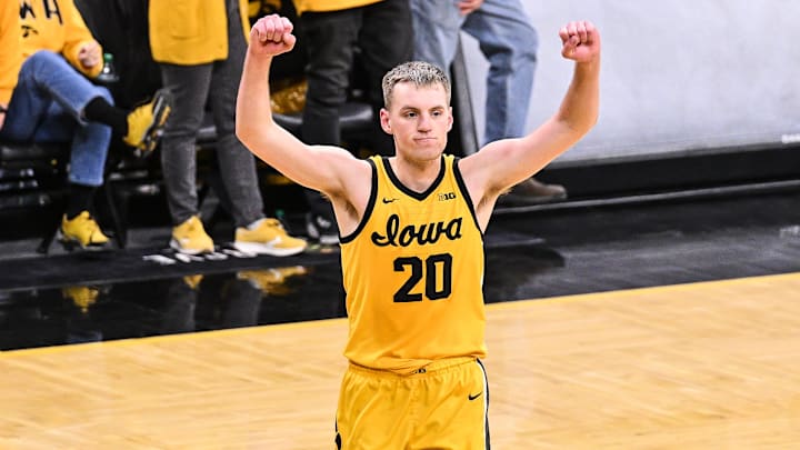 Feb 22, 2025; Iowa City, Iowa, USA; Iowa Hawkeyes forward Payton Sandfort (20) reacts after the game against the Washington Huskies at Carver-Hawkeye Arena. Mandatory Credit: Jeffrey Becker-Imagn Images