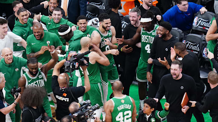 Jun 17, 2024; Boston, Massachusetts, USA; Boston Celtics forward Jayson Tatum (0) celebrates with teammates after defeating the Dallas Mavericks in game five to win the 2024 NBA Finals at TD Garden. Mandatory Credit: David Butler II-USA TODAY Sports