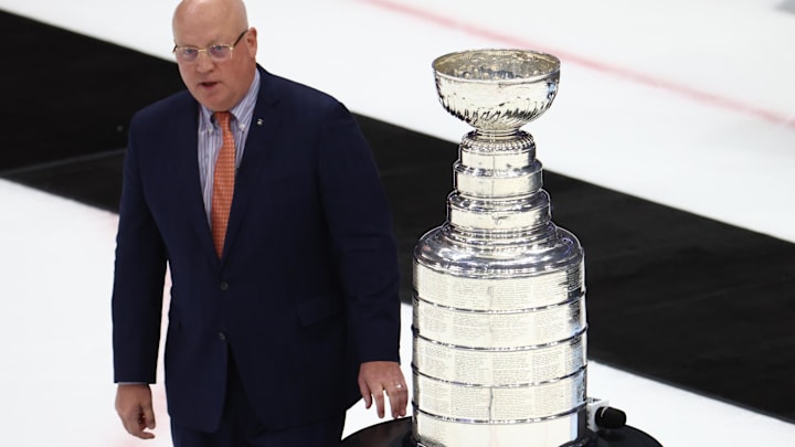 Jun 26, 2022; Tampa, Florida, USA; Deputy NHL Commissioner Bill Daly prepares to present the Colorado Avalanche with the Stanley Cup trophy after defeating the Tampa Bay Lightning during game six of the 2022 Stanley Cup Final at Amalie Arena. Mandatory Credit: Mark J. Rebilas-USA TODAY Sports