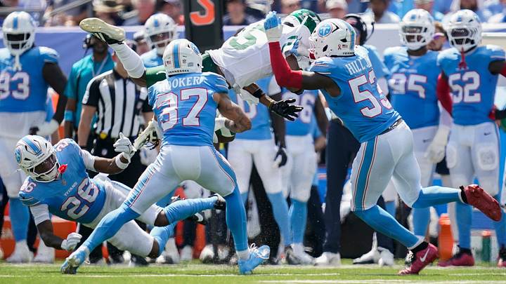 New York Jets wide receiver Garrett Wilson (5) is stopped by Tennessee Titans linebacker Anthony Hill Jr. (53) and safety Amani Hooker (37) during the second quarter at Nissan Stadium in Nashville, Tenn., Sunday, Sept. 13, 2026. New York Jets wide receiver Garrett Wilson (5) is stopped by Tennessee Titans linebacker Anthony Hill Jr. (53) and safety Amani Hooker (37) during the second quarter at Nissan Stadium in Nashville, Tenn., Sunday, Sept. 13, 2026.