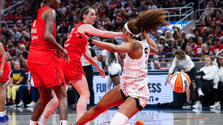May 17, 2025; Indianapolis, Indiana, USA; Indiana Fever guard Caitlin Clark (22) fouls Chicago Sky forward Angel Reese (5)  in the second half at Gainbridge Fieldhouse. Mandatory Credit: Trevor Ruszkowski-Imagn Images