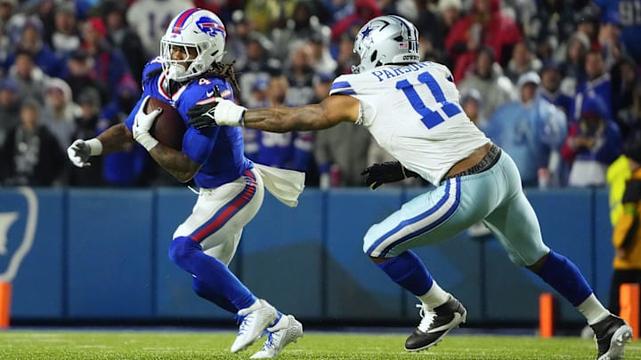 Dec 17, 2023; Orchard Park, New York, USA; Buffalo Bills running back James Cook (4), Dallas Cowboys linebacker Micah Parsons (11) 