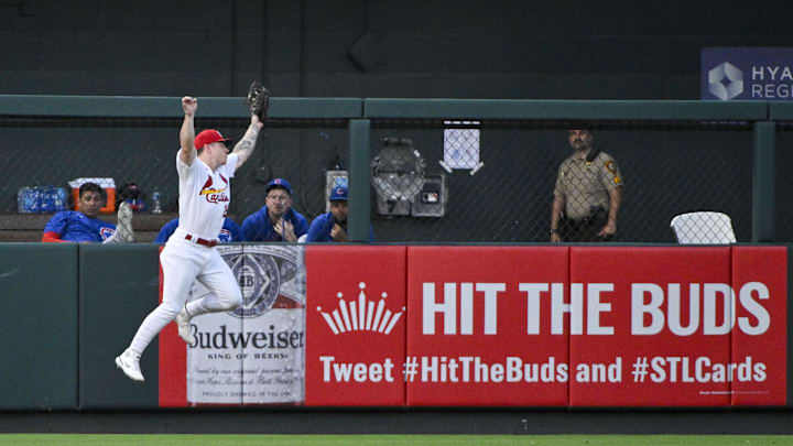Jul 28, 2023; St. Louis, Missouri, USA; St. Louis Cardinals left fielder Tyler O'Neill (27) leaps at the wall and catches a fly ball against the Chicago Cubs during the second inning at Busch Stadium. Mandatory Credit: Jeff Curry-Imagn Images Jul 28, 2023; St. Louis, Missouri, USA; St. Louis Cardinals left fielder Tyler O'Neill (27) leaps at the wall and catches a fly ball against the Chicago Cubs during the second inning at Busch Stadium. Mandatory Credit: Jeff Curry-Imagn Images