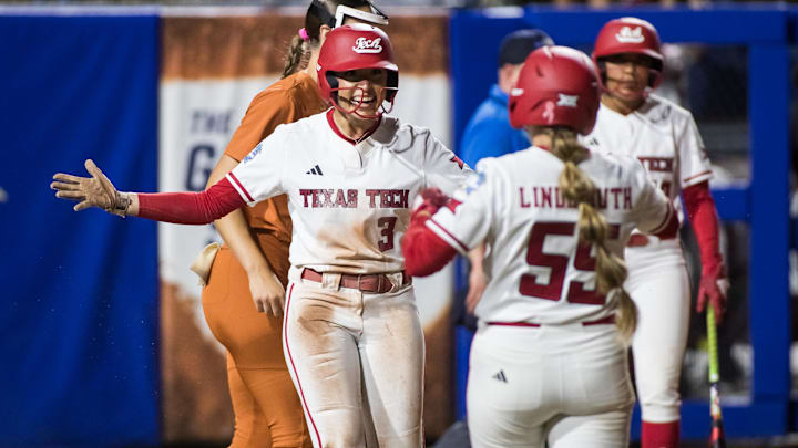 Jun 5, 2025; Oklahoma City, OK, USA;  Texas Tech Red Raiders utility Makayla Garcia (3) celebrates with utility Bailey Lindemuth (55) after scoring a run in the sixth inning against the Texas Longhorns during game two of the NCAA Softball Women's College World Series finals at Devon Park. Mandatory Credit: Brett Rojo-Imagn Images