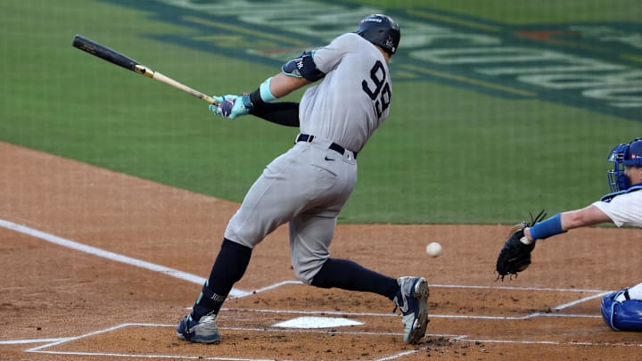 Oct 26, 2024; Los Angeles, California, USA;New York Yankees outfielder Aaron Judge (99) strikes out against the Los Angeles Dodgers in the first inning for game two of the 2024 MLB World Series at Dodger Stadium. Mandatory Credit: Kiyoshi Mio-Imagn Images