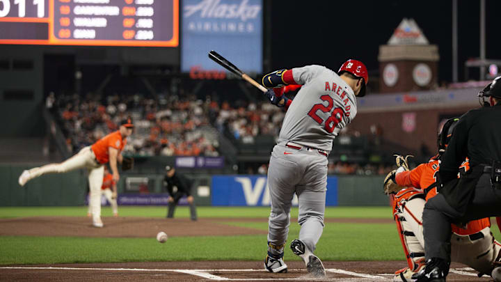 Sep 27, 2024; San Francisco, California, USA; St. Louis Cardinals third baseman Nolan Arenado (28) hits an RBI single off San Francisco Giants starting pitcher Landen Roupp (65) during the first inning at Oracle Park. Mandatory Credit: D. Ross Cameron-Imagn Images