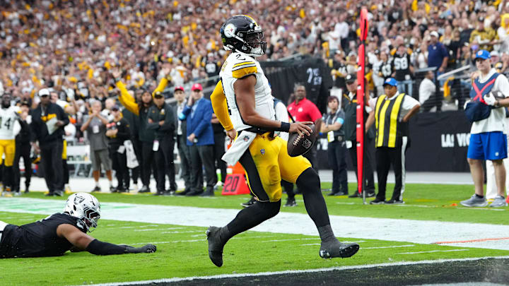 Oct 13, 2024; Paradise, Nevada, USA; Pittsburgh Steelers quarterback Justin Fields (2) scores a rushing touchdown against the Las Vegas Raiders during the second quarter at Allegiant Stadium. Mandatory Credit: Stephen R. Sylvanie-Imagn Images