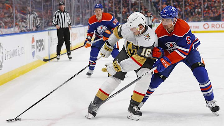 Apr 10, 2024; Edmonton, Alberta, CAN; Vegas Golden Knights forward Pavel Dorofeyev (16) protects the puck from Edmonton Oilers defensemen Cody Ceci (5) during the second period at Rogers Place. Mandatory Credit: Perry Nelson-Imagn Images