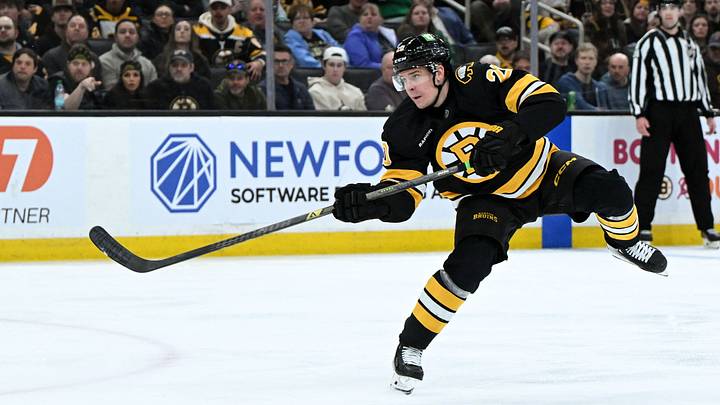 Mar 31, 2026; Boston, Massachusetts, USA; Boston Bruins defenseman Henri Jokiharju (20) shoots and scores against the Dallas Stars during the third period at the TD Garden. Mandatory Credit: Brian Fluharty-Imagn Images