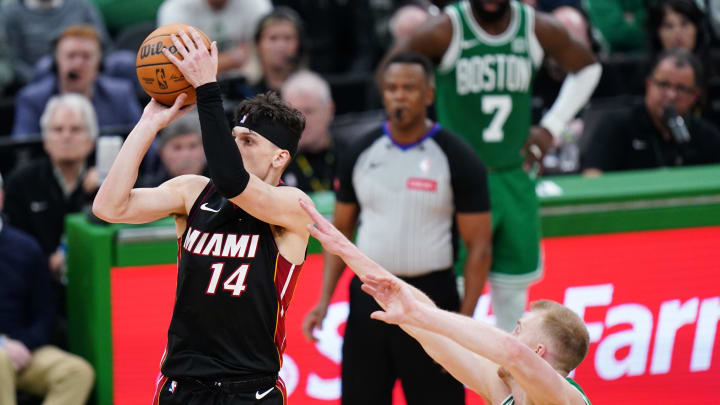 Apr 24, 2024; Boston, Massachusetts, USA; Miami Heat guard Tyler Herro (14) shoots against the