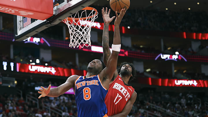 Nov 4, 2024; Houston, Texas, USA; New York Knicks forward OG Anunoby (8) shoots the ball as Houston Rockets forward Tari Eason (17) defends during the third quarter at Toyota Center. Mandatory Credit: Troy Taormina-Imagn Images