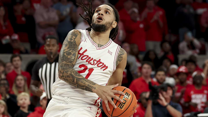 Nov 3, 2025; Houston, Texas, USA; Houston Cougars guard Emanuel Sharp (21) drives to the basket during the first half against the Lehigh Mountain Hawks at Fertitta Center. Mandatory Credit: Maria Lysaker-Imagn Images 