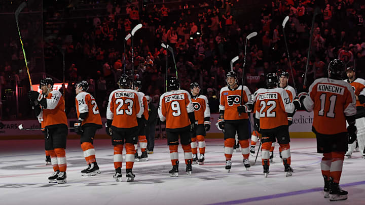 Apr 15, 2025; Philadelphia, Pennsylvania, USA; Philadelphia Flyers players salute the fans after loss to the Columbus Blue Jackets at Wells Fargo Center.
