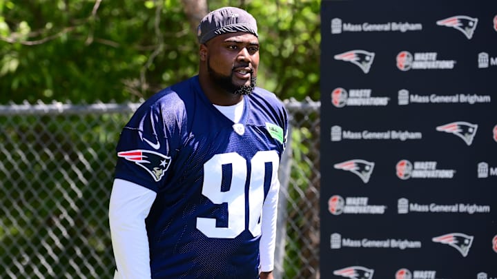 Jun 10, 2024; Foxborough, MA, USA; New England Patriots defensive tackle Christian Barmore (90) walks to the practice fields for minicamp at Gillette Stadium. Mandatory Credit: Eric Canha-Imagn Images