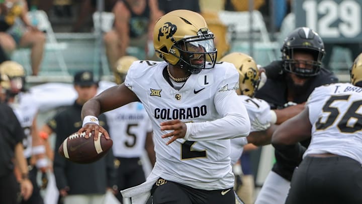 Sep 28, 2024; Orlando, Florida, USA; Colorado Buffaloes quarterback Shedeur Sanders (2) rolls out to pass against the UCF Knights during the first quarter at FBC Mortgage Stadium. Mandatory Credit: Mike Watters-Imagn Images Sep 28, 2024; Orlando, Florida, USA; Colorado Buffaloes quarterback Shedeur Sanders (2) rolls out to pass against the UCF Knights during the first quarter at FBC Mortgage Stadium. Mandatory Credit: Mike Watters-Imagn Images