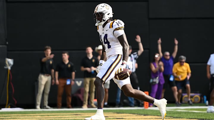 Oct 18, 2025; Nashville, Tennessee, USA;  Louisiana State Tigers tight end Trey'Dez Green (14) scores on the two point conversion against the Vanderbilt Commodores during the second half at FirstBank Stadium. Mandatory Credit: Steve Roberts-Imagn Images