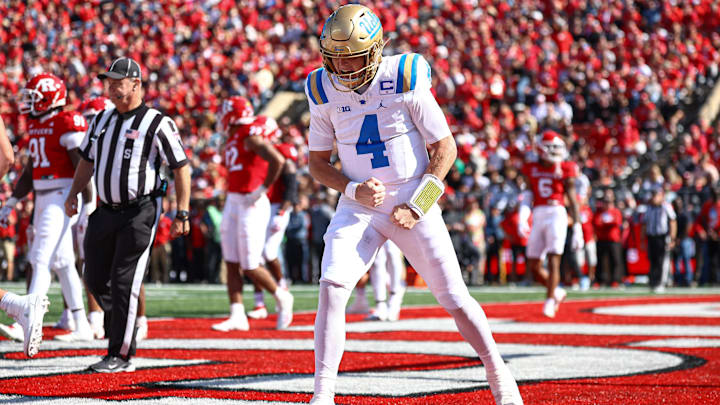 Oct 19, 2024; Piscataway, New Jersey, USA; UCLA Bruins quarterback Ethan Garbers (4) celebrates after a rushing touchdown during the first half against the Rutgers Scarlet Knights at SHI Stadium. Mandatory Credit: Vincent Carchietta-Imagn Images
