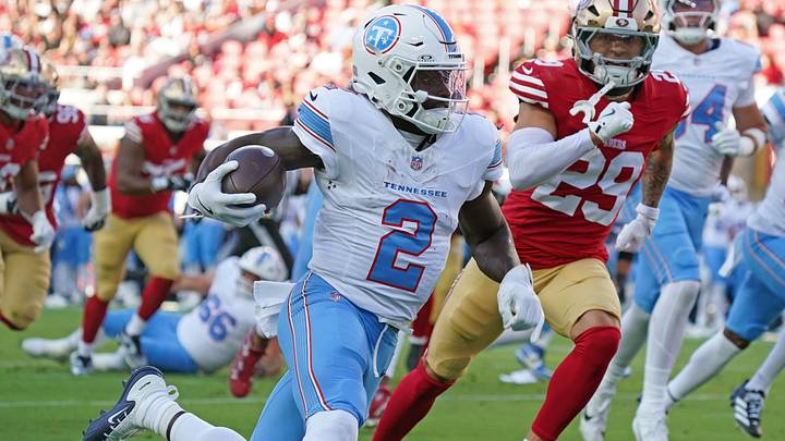Tennessee Titans running back Tyjae Spears rushes the ball while pursued by San Francisco 49ers safety Ashtyn Davis. Tennessee Titans running back Tyjae Spears rushes the ball while pursued by San Francisco 49ers safety Ashtyn Davis.