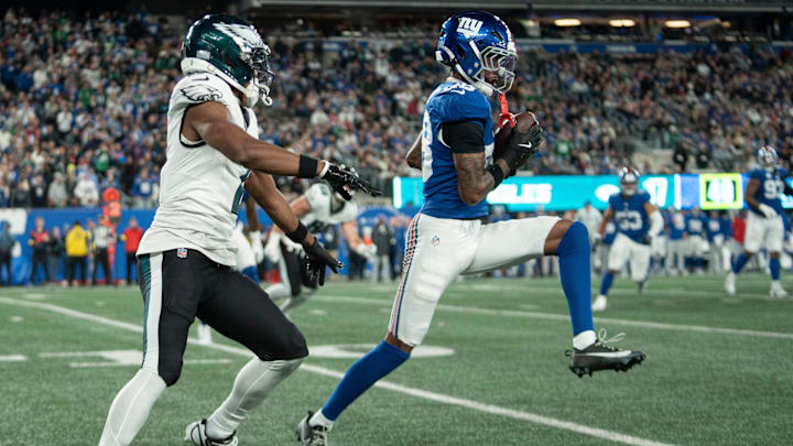 Former New York Giants cornerback Cordale Flott (28) intercepts a pass intended Philadelphia Eagles wide receiver Jahan Dotson (2)