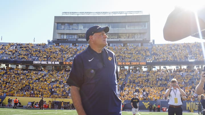 Aug 30, 2025; Morgantown, West Virginia, USA; West Virginia Mountaineers head coach Rich Rodriguez sings “Country Roads” after defeating the Robert Morris Colonials at Milan Puskar Stadium. Mandatory Credit: Ben Queen-Imagn Images