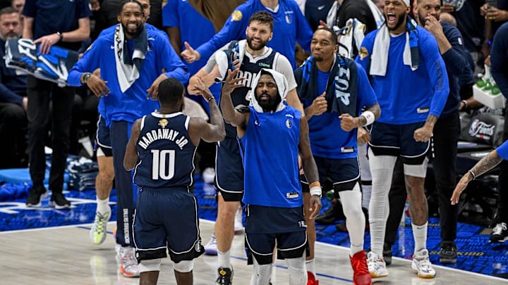Jun 14, 2024; Dallas, Texas, USA; Dallas Mavericks forward Tim Hardaway Jr. (10) celebrates with his teammates after he makes a three point shot against the Boston Celtics during the game between the Dallas Mavericks and the Boston Celtics in game four of the 2024 NBA Finals at American Airlines Center. Mandatory Credit: Jerome Miron-Imagn Images