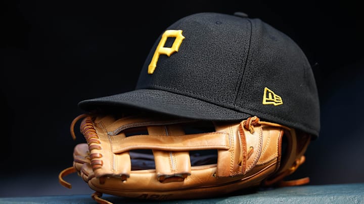 A general view of a Pittsburgh Pirates glove and hat in the eighth inning against the Colorado Rockies at Coors Field. 