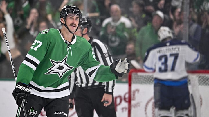 Dec 1, 2024; Dallas, Texas, USA; Dallas Stars left wing Mason Marchment (27) skates back to the team bench after he scores the game winning goal against Winnipeg Jets goaltender Connor Hellebuyck (37) during the third period at the American Airlines Center. Mandatory Credit: Jerome Miron-Imagn Images