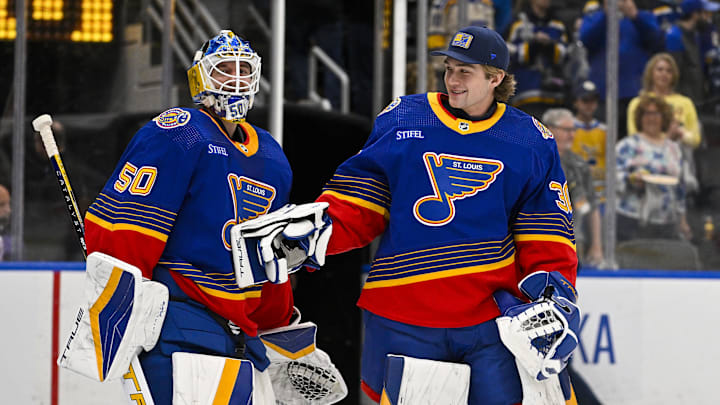 Mar 13, 2024; St. Louis, Missouri, USA; St. Louis Blues goaltender Jordan Binnington (50) celebrates with goaltender Joel Hofer (30) after the Blues defeated the Los Angeles Kings at Enterprise Center. Mandatory Credit: Jeff Curry-Imagn Images Mar 13, 2024; St. Louis, Missouri, USA; St. Louis Blues goaltender Jordan Binnington (50) celebrates with goaltender Joel Hofer (30) after the Blues defeated the Los Angeles Kings at Enterprise Center. Mandatory Credit: Jeff Curry-Imagn Images