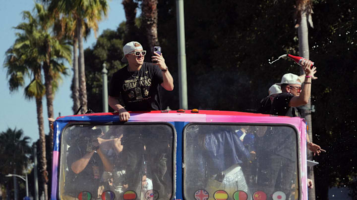 Nov 1, 2024; Los Angeles, CA, USA; Los Angeles Dodgers outfielder Enrique Hernandez (8) celebrates with teammates on the bus during the 2024 World Series championship parade near Los Angeles City Hall. Mandatory Credit: Kirby Lee-Imagn Images